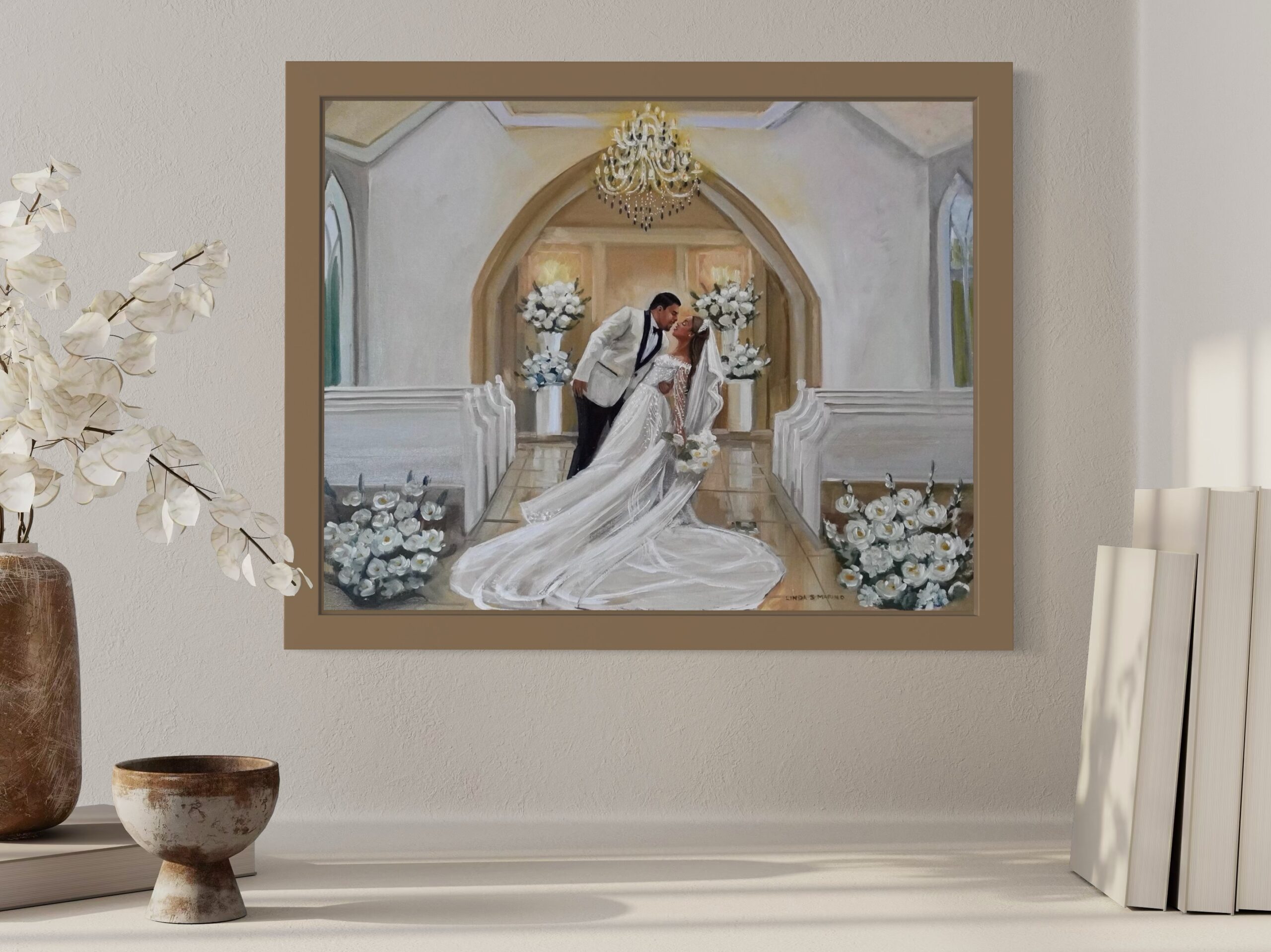 live wedding painting of couple in chapel framed and in room setting