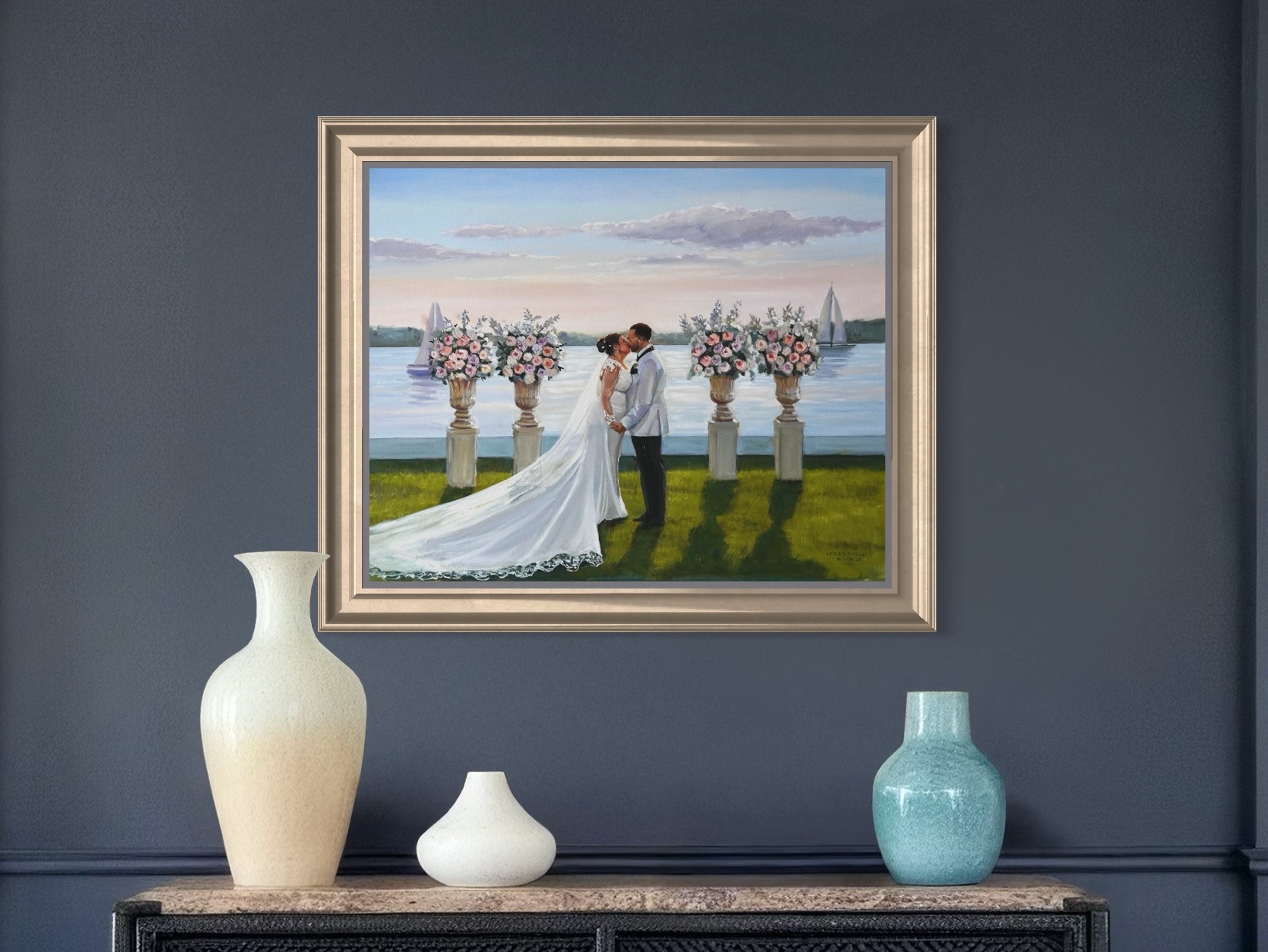 Wedding portrait painting framed and hanging on dark blue wall